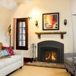 Cozy living room featuring a sleek direct-vent natural gas fireplace casting warm glow on modern furniture.