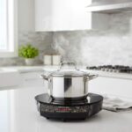 Nuwave Gold Induction Cooktop in a modern kitchen setting with steaming pot