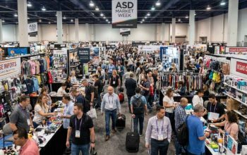 Crowded trade show floor at ASD Market Week Las Vegas with exhibitor booths and retail buyers