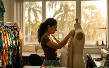Miami fashion creator preparing camera equipment before runway event