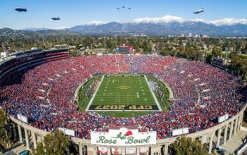 Aerial view of the packed Rose Bowl Stadium in Pasadena, California on New Year's Day 2027 during the CFP Quarterfinal game with the San Gabriel Mountains visible in the background