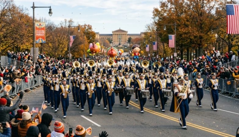 Marching band performing along the Benjamin Franklin Parkway during the Philadelphia Thanksgiving parade