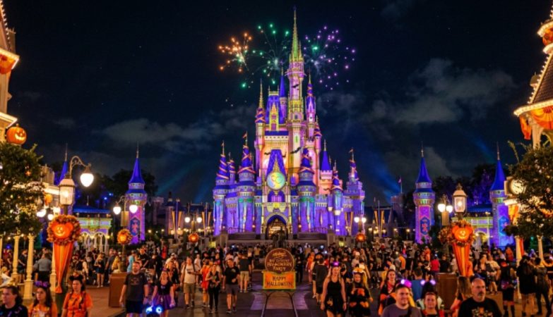 Magic Kingdom castle lit up for Halloween night celebration