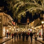Historic downtown St. Augustine street covered in white holiday lights at night